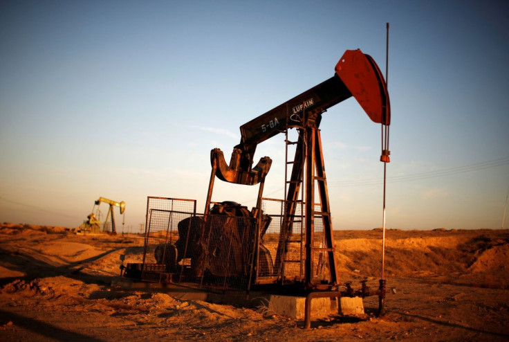 Pump Jacks are seen at sunrise near Bakersfield, California, October 14, 2014. 