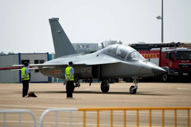 Pilots operate a JL-10 advance trainer jet of Chinese People's Liberation Army (PLA) Air ForceÂ at the China International Aviation and Aerospace Exhibition, or Airshow China, in Zhuhai, Guangdong province, China September 28, 2021. 