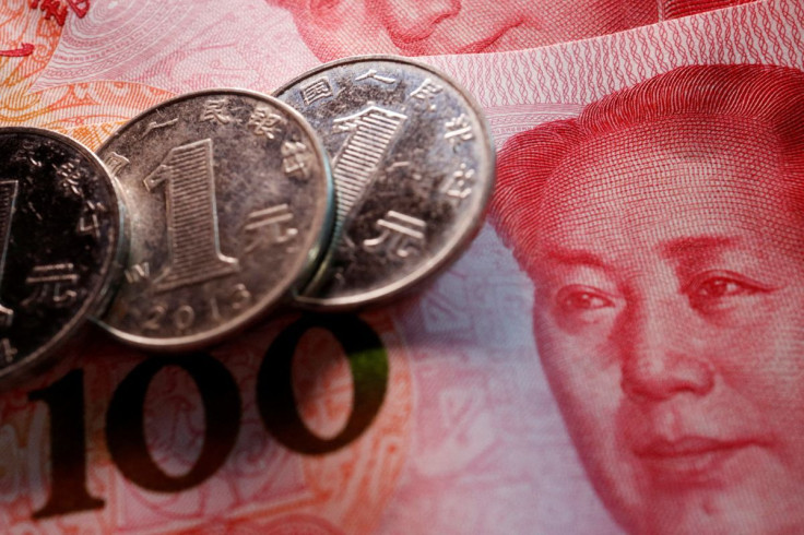 Coins and banknotes of China's yuan are seen in this illustration picture taken February 24, 2022. 