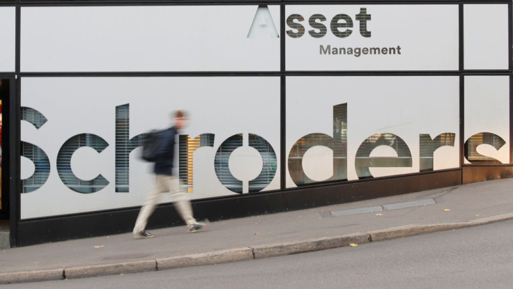 A man walks past the logo of investment management company Schroders at a branch in Zurich, Swtzerland November 5, 2018.