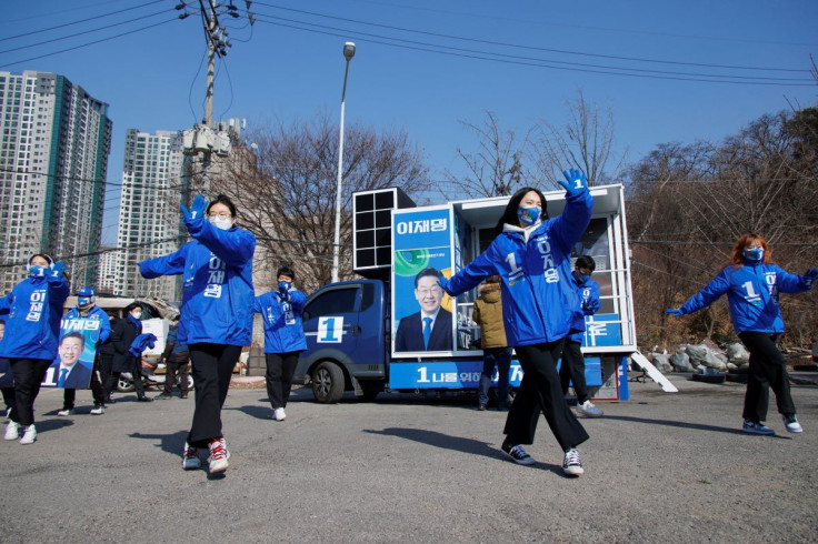 Youth campaign group of Lee Jae-myung, a presidential candidate of South Korea's ruling Democratic Party, cheer during their campaign rally at a campaign site in Seoul, South Korea, February 24, 2022.