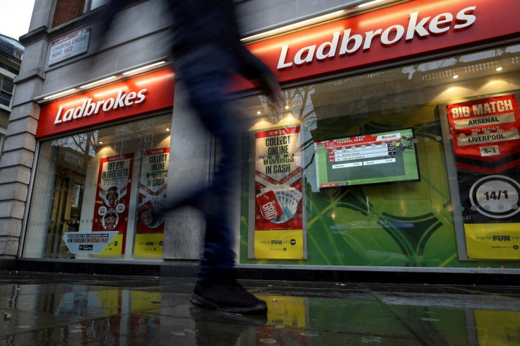 A pedestrian walks past a branch of Ladbrokes in London, Britain December 22, 2017.