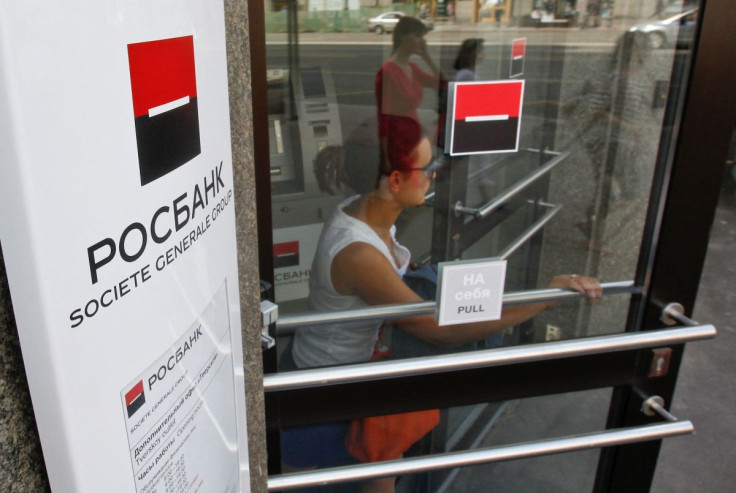 A woman walks out of an office of Rosbank, Societe Generale's Russian unit, in Moscow, May 15, 2013. 