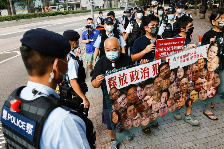 Pro-democracy protesters hold a banner during a protest urging for the release of political prisoners at Chinese National Day, in Hong Kong, China October 1, 2021. 