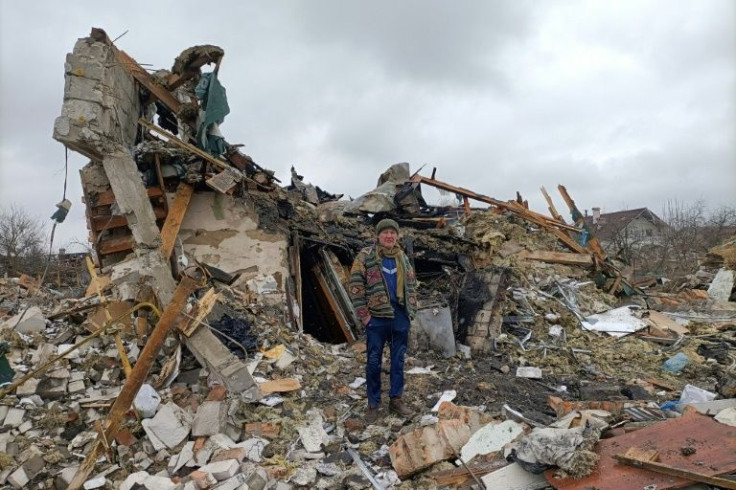 A Ukrainian man stands in the rubble in Zhytomyr following a Russian missile strike