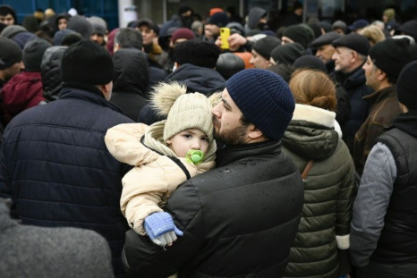 Refugees from Ukraine wait to enter a camp in the Moldovan capital Chisinau on Thursday