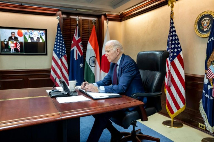 US President Joe Biden virtually meets with Quad leaders -- on screen are Japanese Prime Minister Fumio Kishida (top L), Indian Prime Minister Narendra Modi (top R) and Australian Prime Minister Scott Morrison