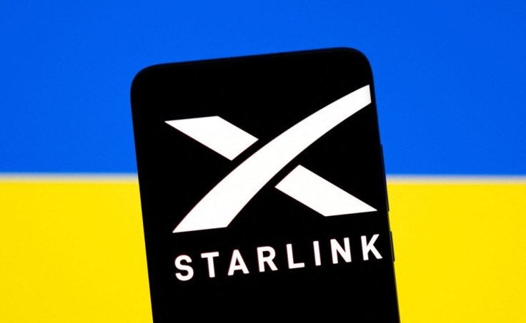 Starlink logo is seen on a smartphone in front of displayed Ukrainian flag in this illustration taken February 27, 2022. 