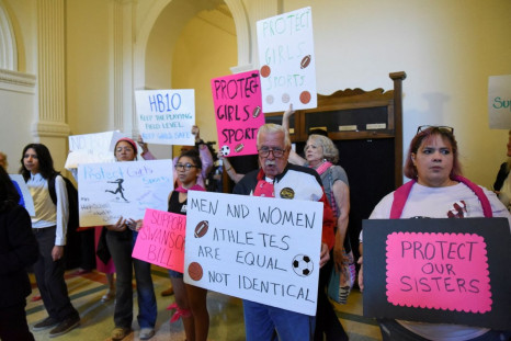 Demonstrators line the hallway to the House Chamber to protest against transgender girls participating in female sports, as the Texas House of Representatives convenes a third special legislative session for controversial legislative items at the State Ca