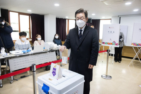 Lee Jae-myung, the presidential candidate of South Korea's ruling Democratic Party, casts his early vote for the upcoming March 9 presidential election at a polling station in Seoul, South Korea, March 4, 2022.   Lee Hee-hoon/Pool via Reuters