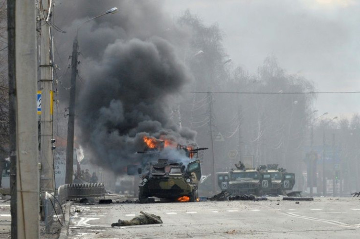 a-russian-armoured-personnel-carrier-burns-next-to