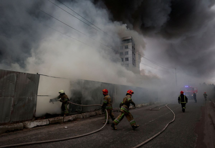 Firefighters extinguish fire at a warehouse that caught flames, according to local authorities, after shelling, as Russia's invasion of Ukraine continues, in the village of Chaiky in the Kyiv region, Ukraine March 3, 2022.