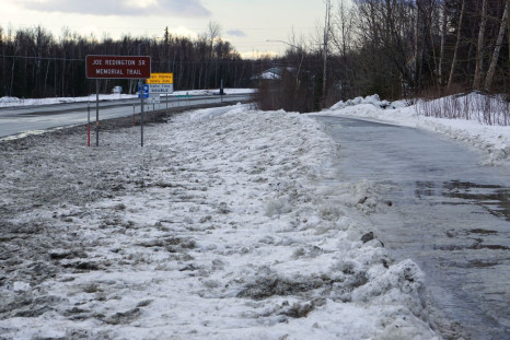 The Joe Redington Sr. Memorial Trail, named for the homesteader who was the "Father of the Iditarod," is a ribbon of ice, with some spots of bare pavement, in Wasilla, Alaska, U.S., February 25, 2022. Winter rains, which are increasing in frequency as the