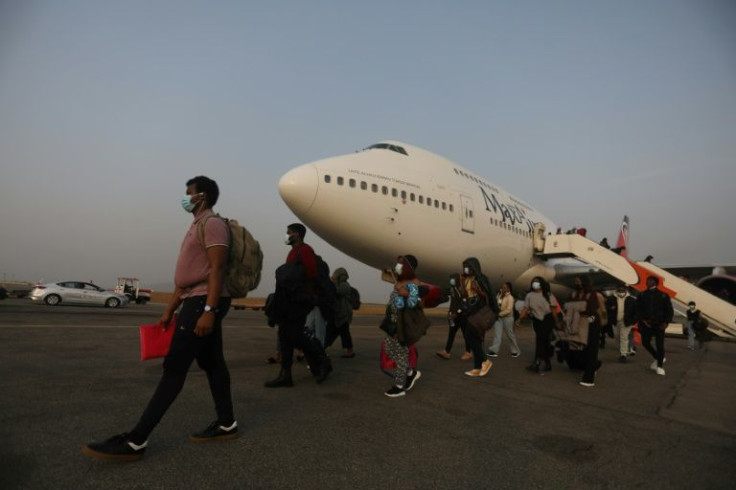 Nigerian students who escaped from Ukraine's conflict were flown back home on Friday
