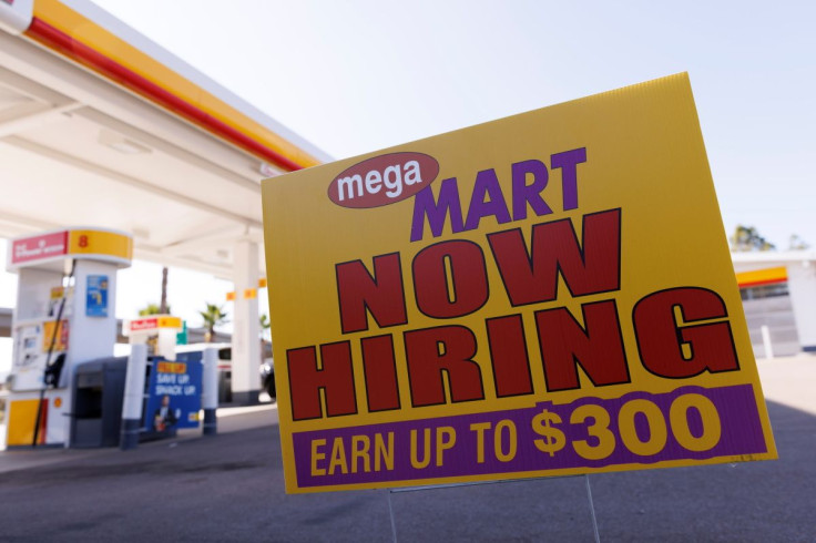 A job posting looking for workers is shown at a gas station in San Diego, California, U.S. November, 9, 2021.  