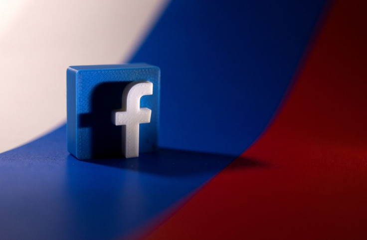 Facebook logo is placed on a Russian flag in this illustration picture taken February 26, 2022. 