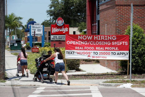 A Wendyâs restaurant displays a "Now Hiring" sign in Tampa, Florida, U.S., June 1, 2021.  