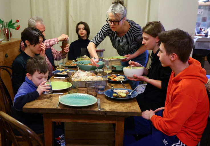 Ukrainian refugees eat dinner in the flat of a Berlin family which is hosting them, following Russia's invasion of Ukraine, in Berlin, Germany, March 4, 2022.