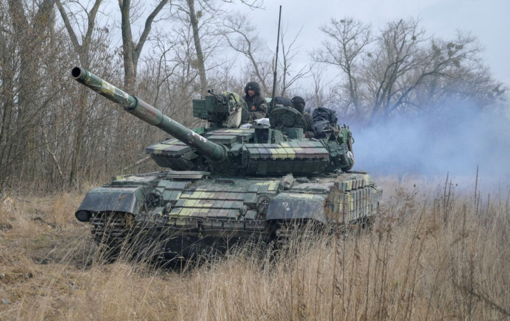 Service members of the Ukrainian armed forces are seen atop of a tank at their positions outside the settlement of Makariv, amid the Russian invasion of Ukraine, near Zhytomyr, Ukraine March 4, 2022. 