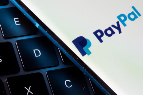 A smartphone with the PayPal logo is placed on a laptop in this illustration taken on July 14, 2021. 