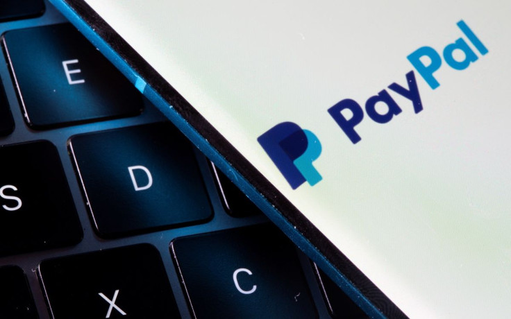 A smartphone with the PayPal logo is placed on a laptop in this illustration taken on July 14, 2021. 