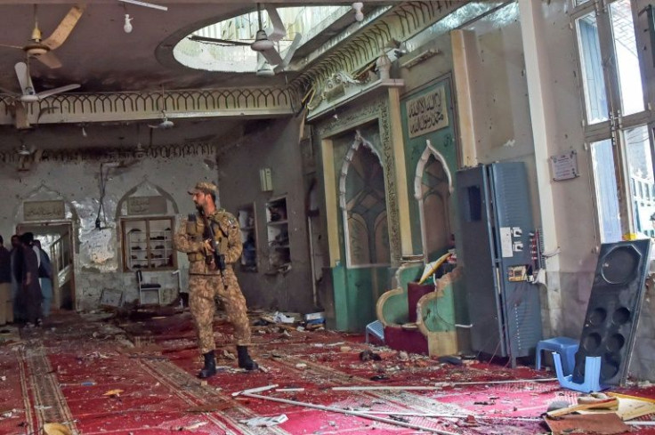 The death toll from the suicide bombing of a Shiite mosque in Peshawar has risen to 62 as police try to ID the attacker
