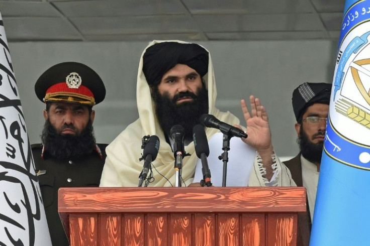Taliban Interior Minister Sirajuddin Haqqani was photographed openly for the first time at a ceremony for new police recruits