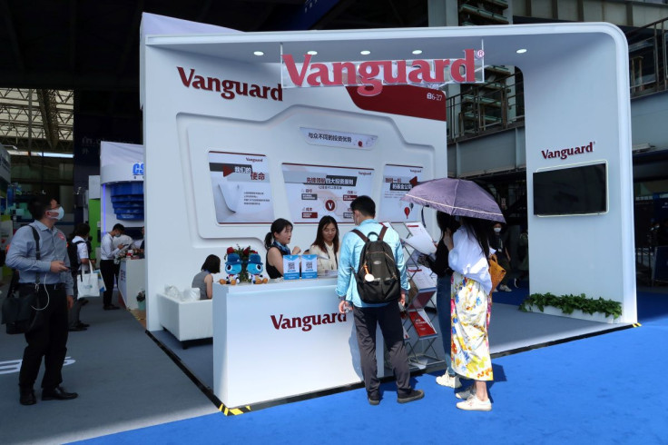 People are seen at a booth of Vanguard Group at a fair during the INCLUSION fintech conference in Shanghai, China September 24, 2020. 