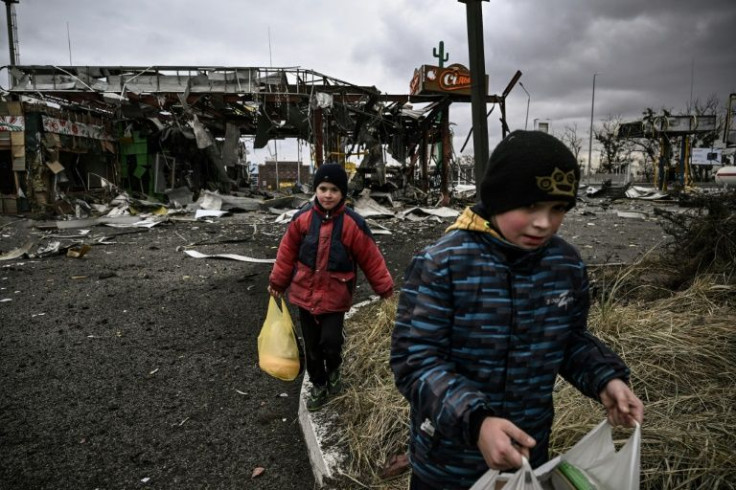 A grocery story that stood on a major intersection on Friday had been reduced to rubble by Saturday