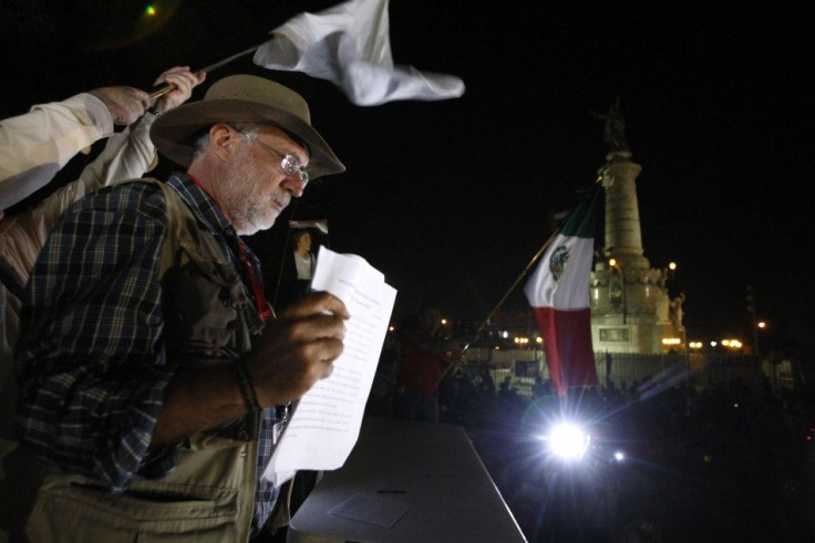 Mexican poet Sicilia shows the final document for the &quot;national pact&quot; in Ciudad Juarez
