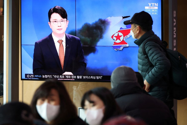 People watch a TV broadcasting a news report on North Korea's firing a ballistic missile off its east coast, in Seoul, South Korea, March 5, 2022.   
