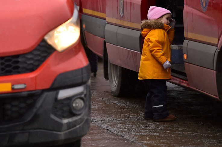 A child looks on board a bus that will take her and her family to a nearby city, after fleeing from Ukraine to Romania, following Russia's invasion of Ukraine, at the border crossing in Siret, Romania, March 5, 2022. 