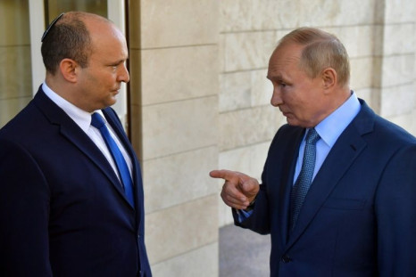 Israeli Prime Minister Naftali Bennett (L) made a surprise visit to the Kremlin for three hours of talks with Russian President Vladimir Putin