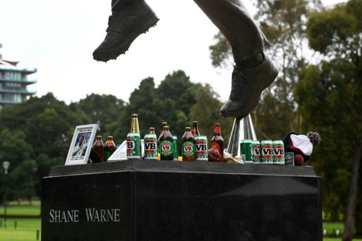 Fans left unusual offerings -- among them cigarettes, beer and meat pies -- to remember the famously hard-living athlete