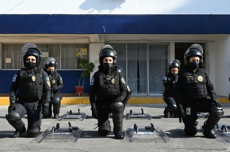 Members of the women police squad are taught how to use a riot shield and not to be provoked by protesters