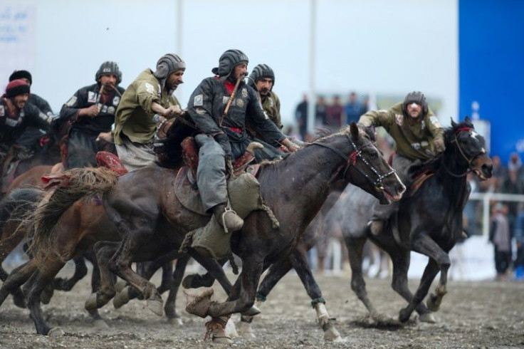 With his whip between his teeth, a Kandahar rider races for the centre-circle while clutching the "carcass"