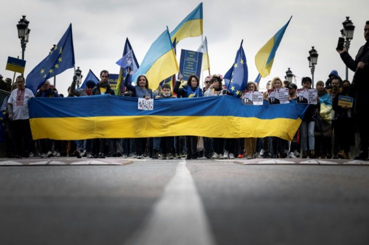 Protesters in Toulouse -- which is twinned with Ukraine's capital Kyiv -- assembled behind a large banner