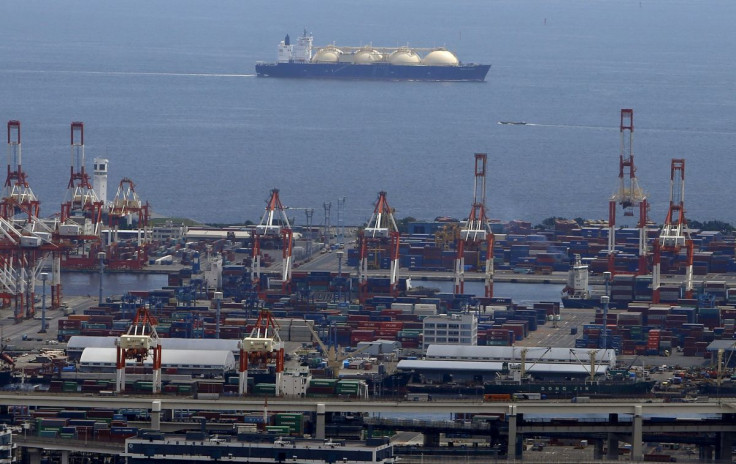 A LNG (Liquefied Natural Gas) tanker is seen behind a port in Yokohama, south of Tokyo, Japan, September 4, 2015.