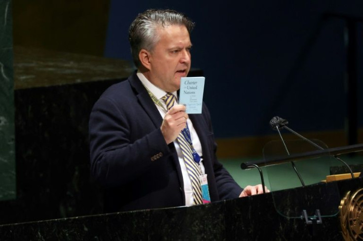 Ukraine's UN Ambassador Sergiy Kyslytsya holds a copy of the UN Charter as he speaks at the UN General Assembly Emergency session in New York on March 2, 2022 before a vote on a resolution condemning Russian invasion of Ukraine