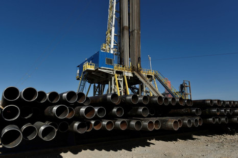 Drill pipe is seen below a drilling rig on a lease owned by Oasis Petroleum in the Permian Basin near Wink, Texas U.S. August 22, 2018.  