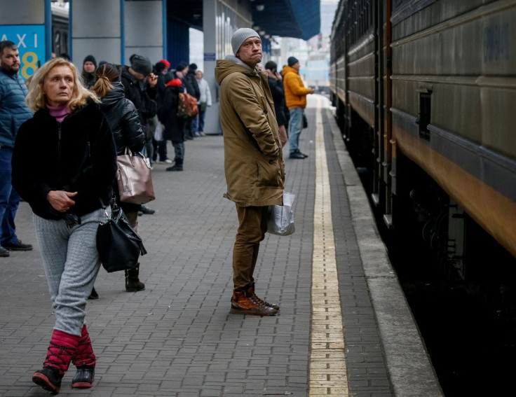 People react as an evacuation train with their relatives leaves from Kyiv to Lviv, following Russia's invasion of Ukraine, at Kyiv central train station, in Kyiv, Ukraine March 6, 2022.
