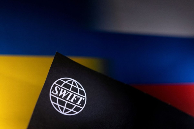 Swift logo is placed on Ukrainian's and Russian's flag colors in this illustration taken, Bosnia and Herzegovina, February 25, 2022. 