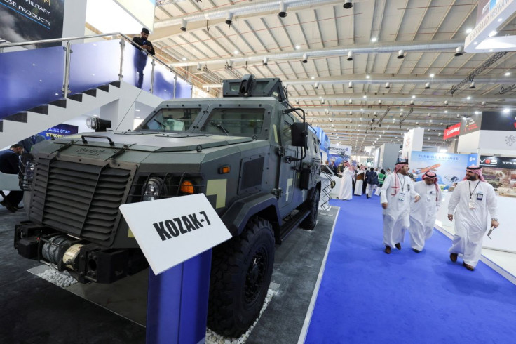 Saudi men are seen walking in front of Ukrainian stand displaying the latest defense system at World Defense Show in Riyadh, Saudi Arabia, March 6, 2022.