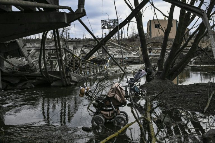The border between Kyiv and its suburb of Irpin has turned into a warzone that residents must cross when the flee the fighting