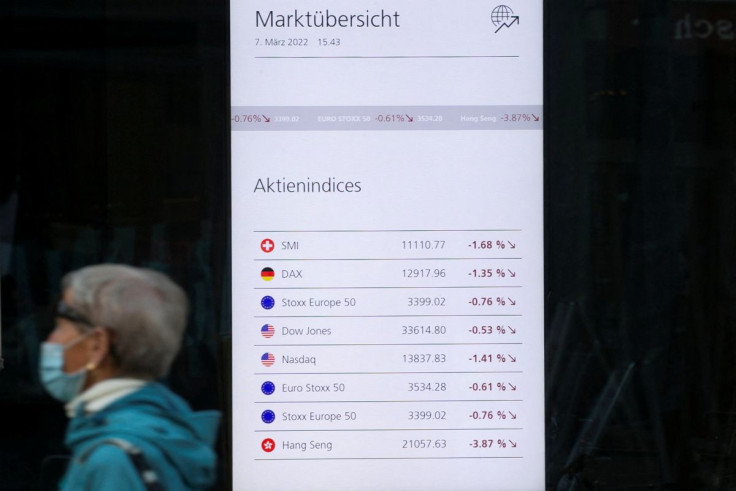 A display shows financial information in a window of the headquarters of Swiss bank UBS, amid Russia's invasion of Ukraine, in Zurich, Switzerland March 7, 2022. 