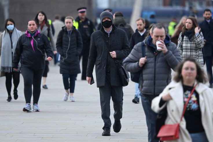 Workers cross London Bridge during the morning rush hour, on the anniversary of Britain's first coronavirus disease (COVID-19) lockdown, in London, Britain, March 23, 2021.