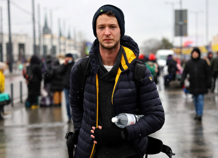 Michael, a foreign fighter poses for a picture, as he and other volunteers are ready to depart towards the front line in the east of Ukraine following the Russian invasion, at the main train station in Lviv, Ukraine, March 5, 2022. 