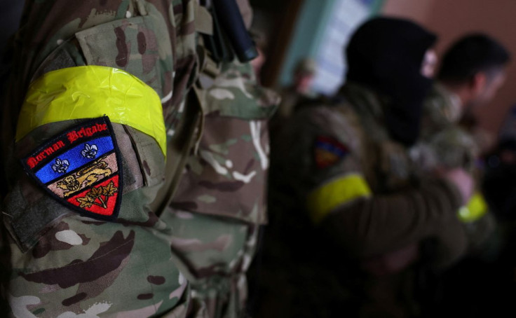 A badge is pictured on a uniform of a foreign fighter from the UK as they are ready to depart towards the front line in the east of Ukraine following the Russian invasion, at the main train station in Lviv, Ukraine, March 5, 2022.