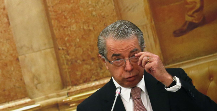 Ricardo Salgado, former CEO of rescued Portugese bank Banco Espirito Santo (BES), adjusts his glasses during a parliament committee to speak on BES' situation at the Portuguese parliament in Lisbon December 9, 2014.