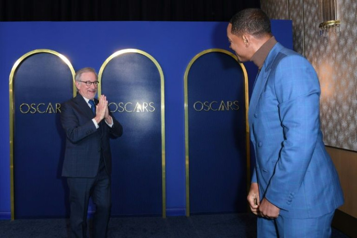 US director Steven Spielberg speaks to actor Will Smith at the Oscars nominees luncheon